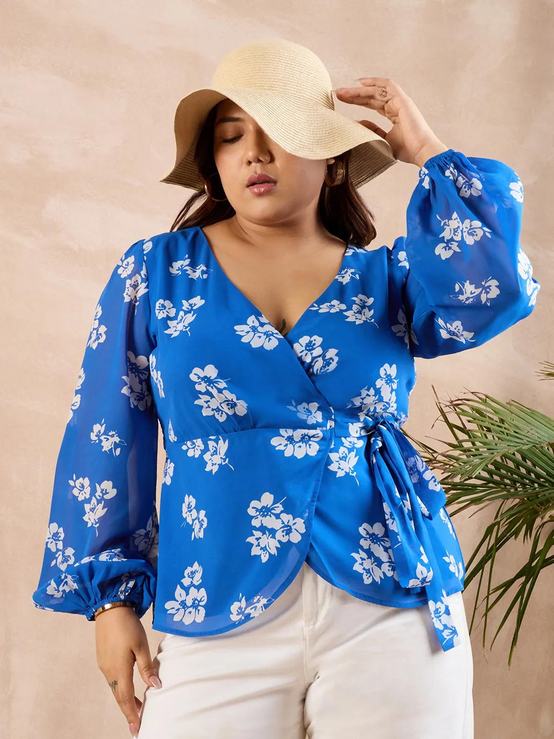 Berrylush Curve Women Blue & White Floral Printed V-Neck Bishop Sleeves Waist Tie-Up Wrap Regular Top