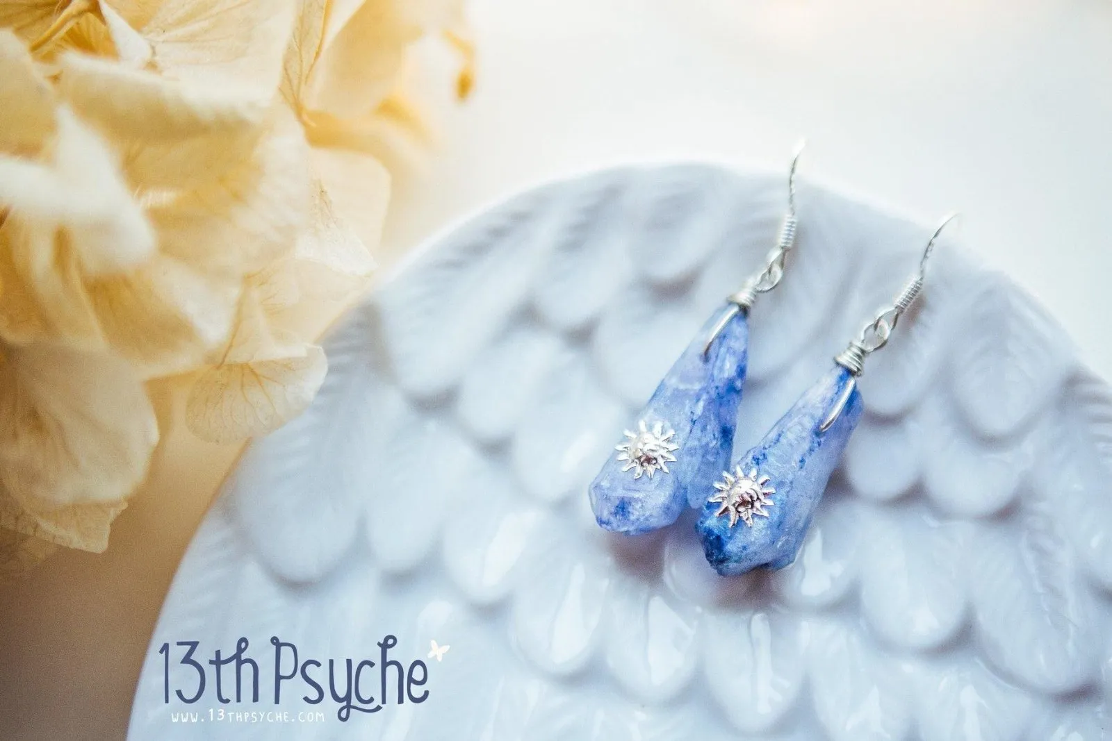 Blue raw crystal earrings with suns