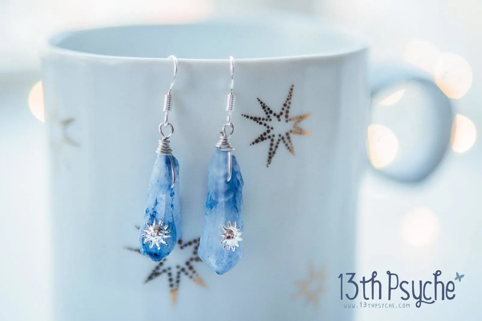 Blue raw crystal earrings with suns