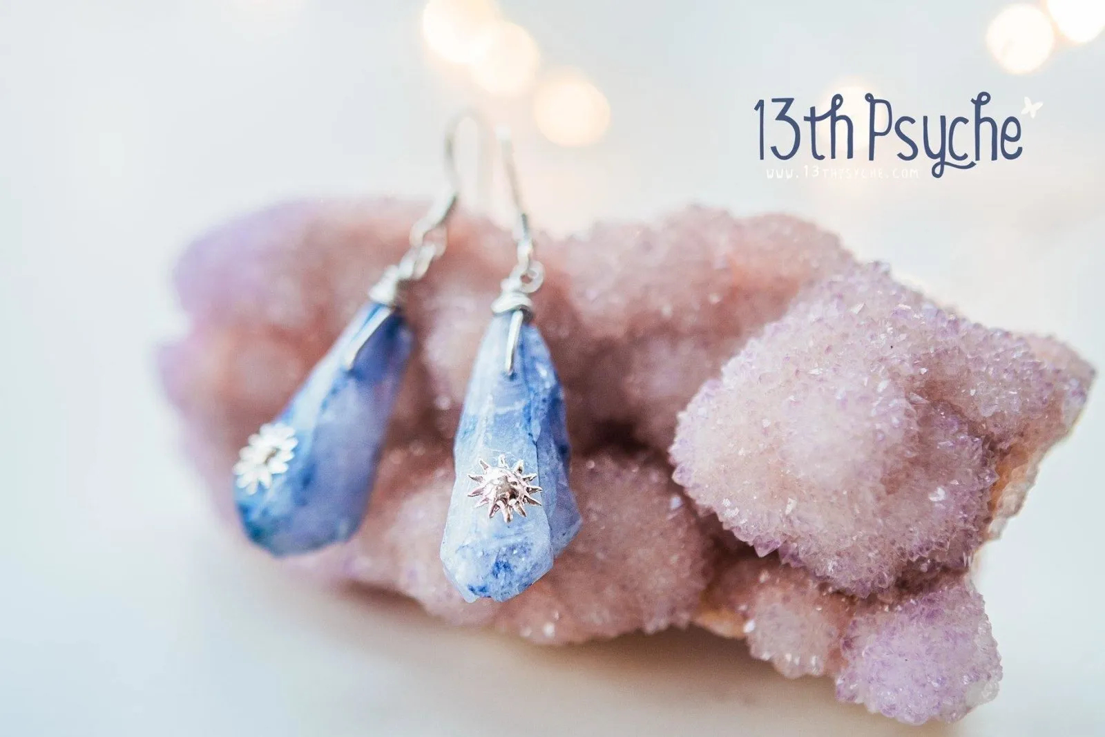 Blue raw crystal earrings with suns