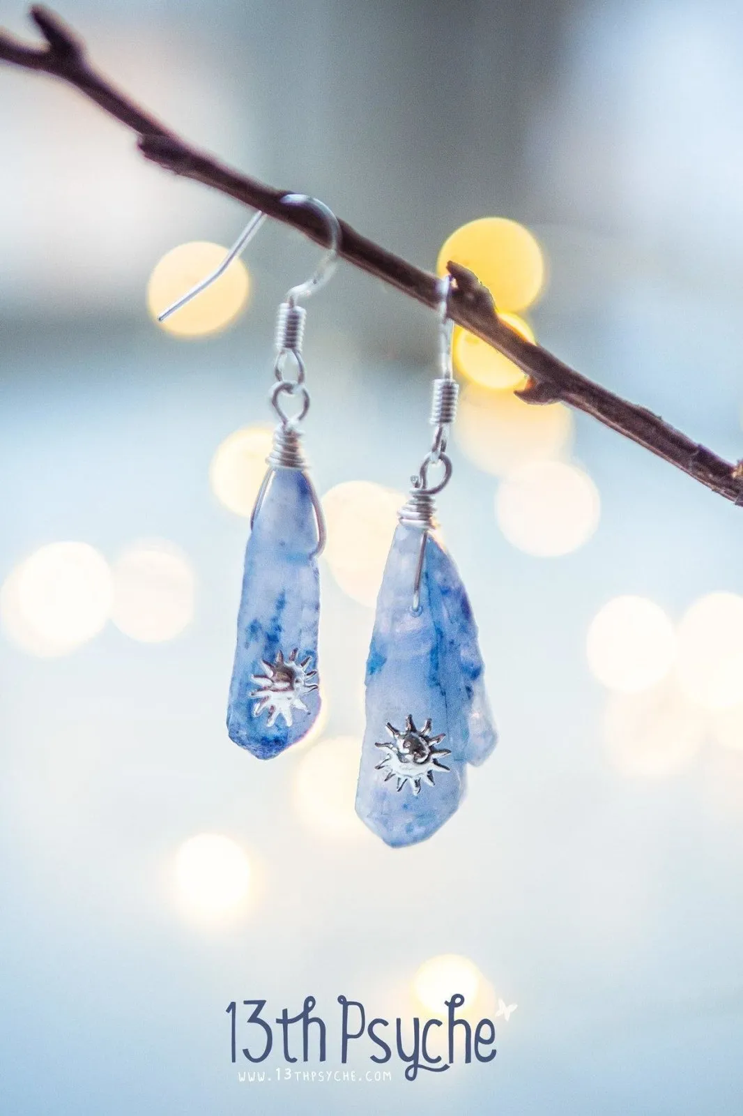 Blue raw crystal earrings with suns