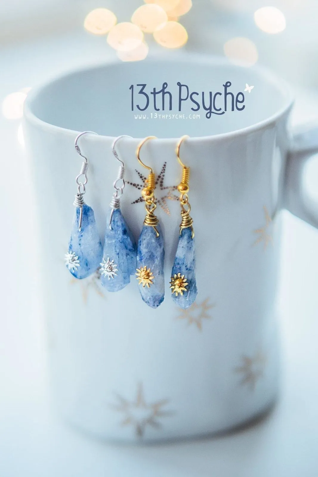 Blue raw crystal earrings with suns